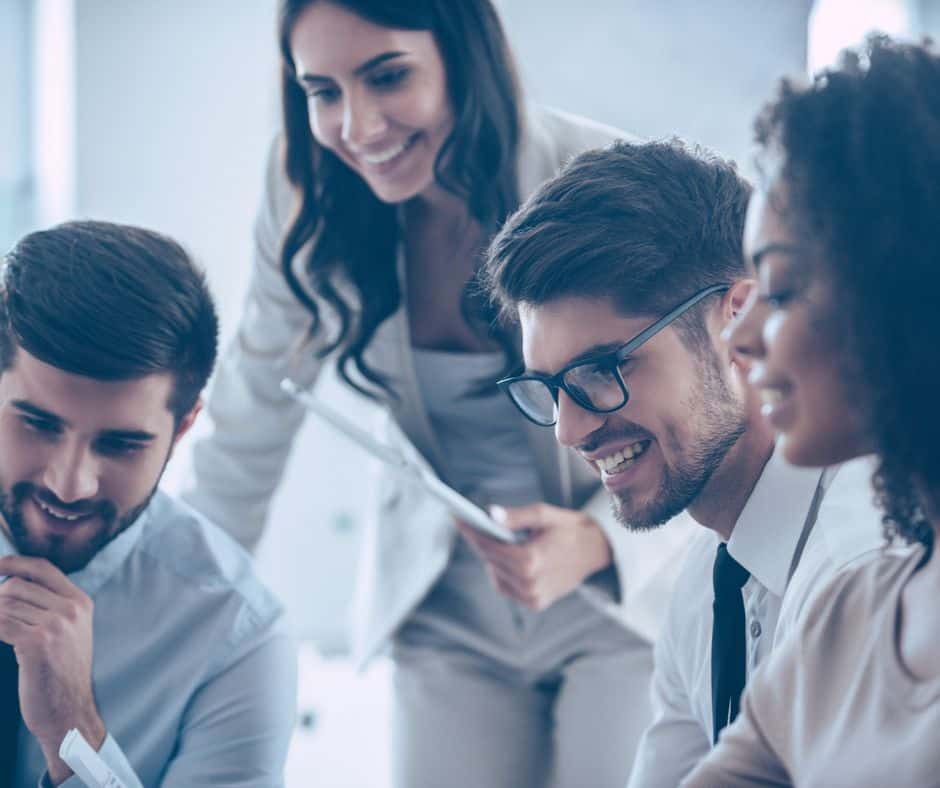 4 Office team members smiling